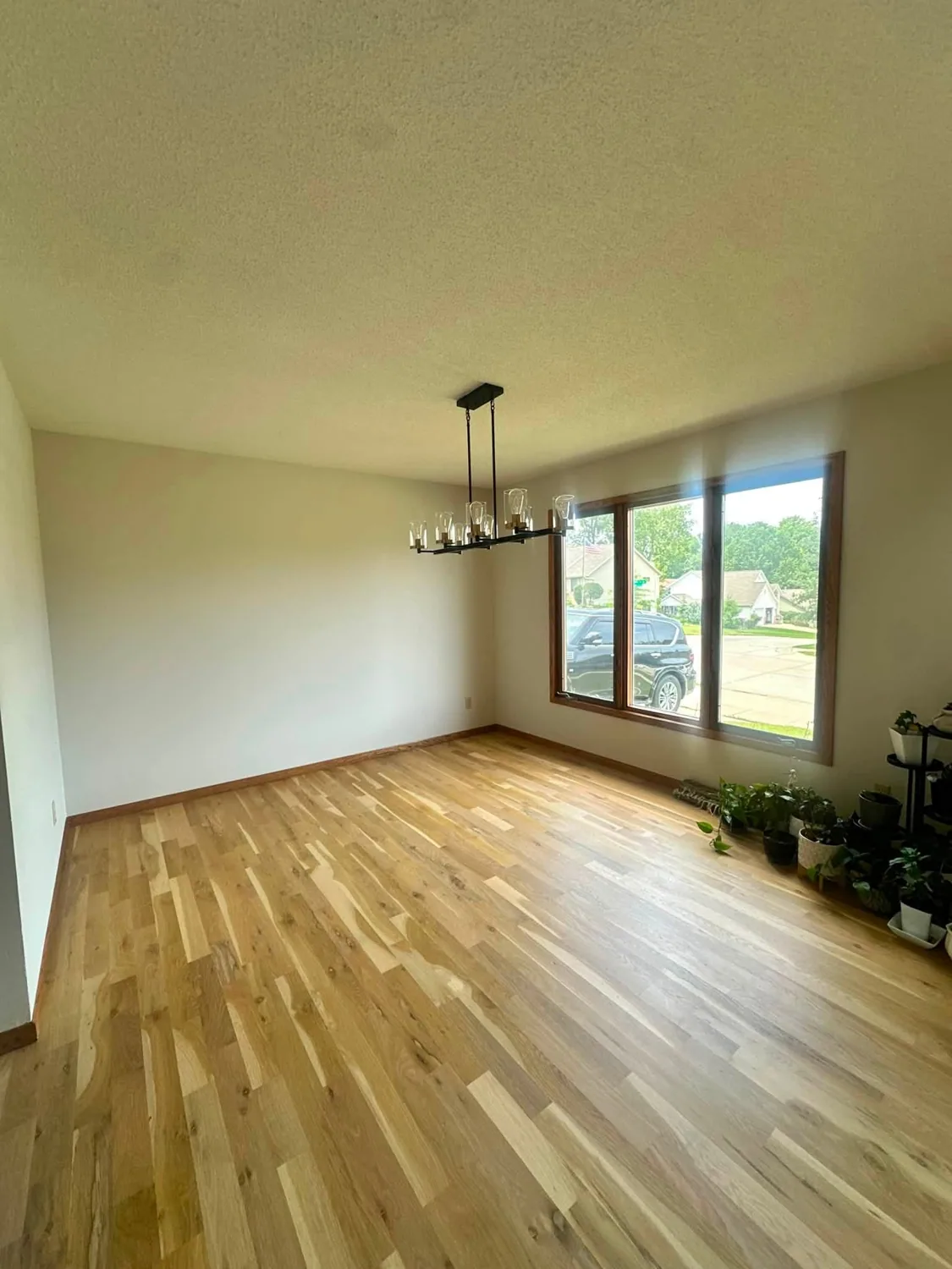 Freshly cleaned living space with wood floors